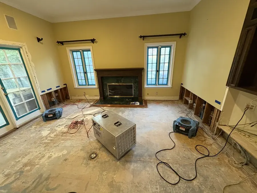 Air movers and a dehumidifier drying a room in Enfield, CT