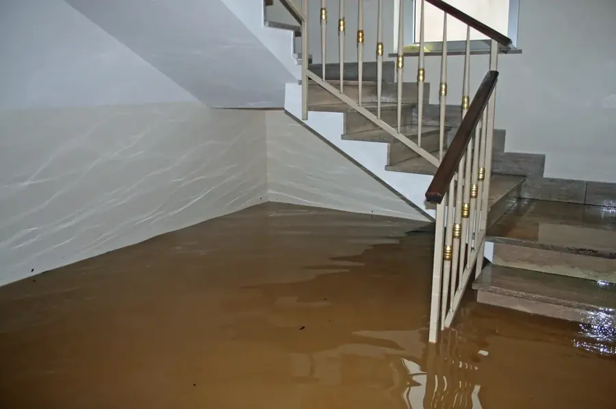 Restoration crew drying a flooded Enfield, CT home with air movers