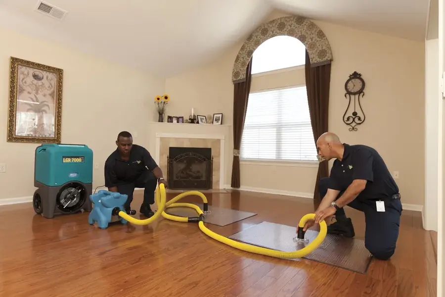 Technician extracting standing water in an Enfield, CT home